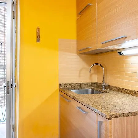 Yellow Near The Train Station With Balcony